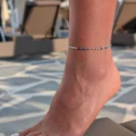 kojos grandinele kristalai