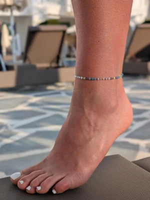 kojos grandinele kristalai