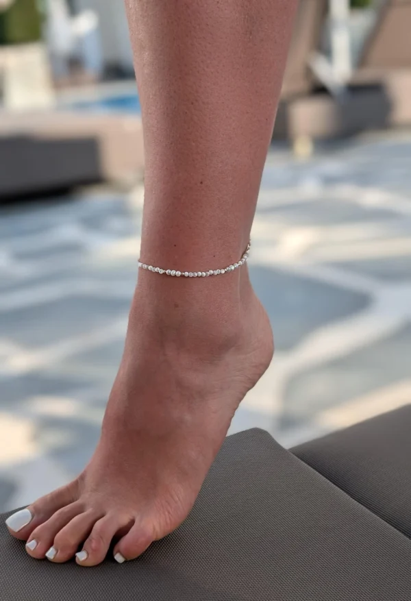 kojos grandinele perlai